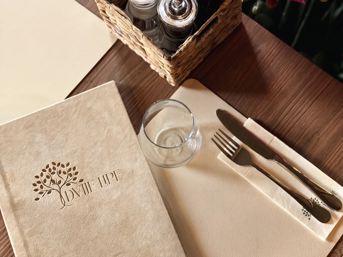 Dvije Lipe – branded menu on the table, restaurant interior detail